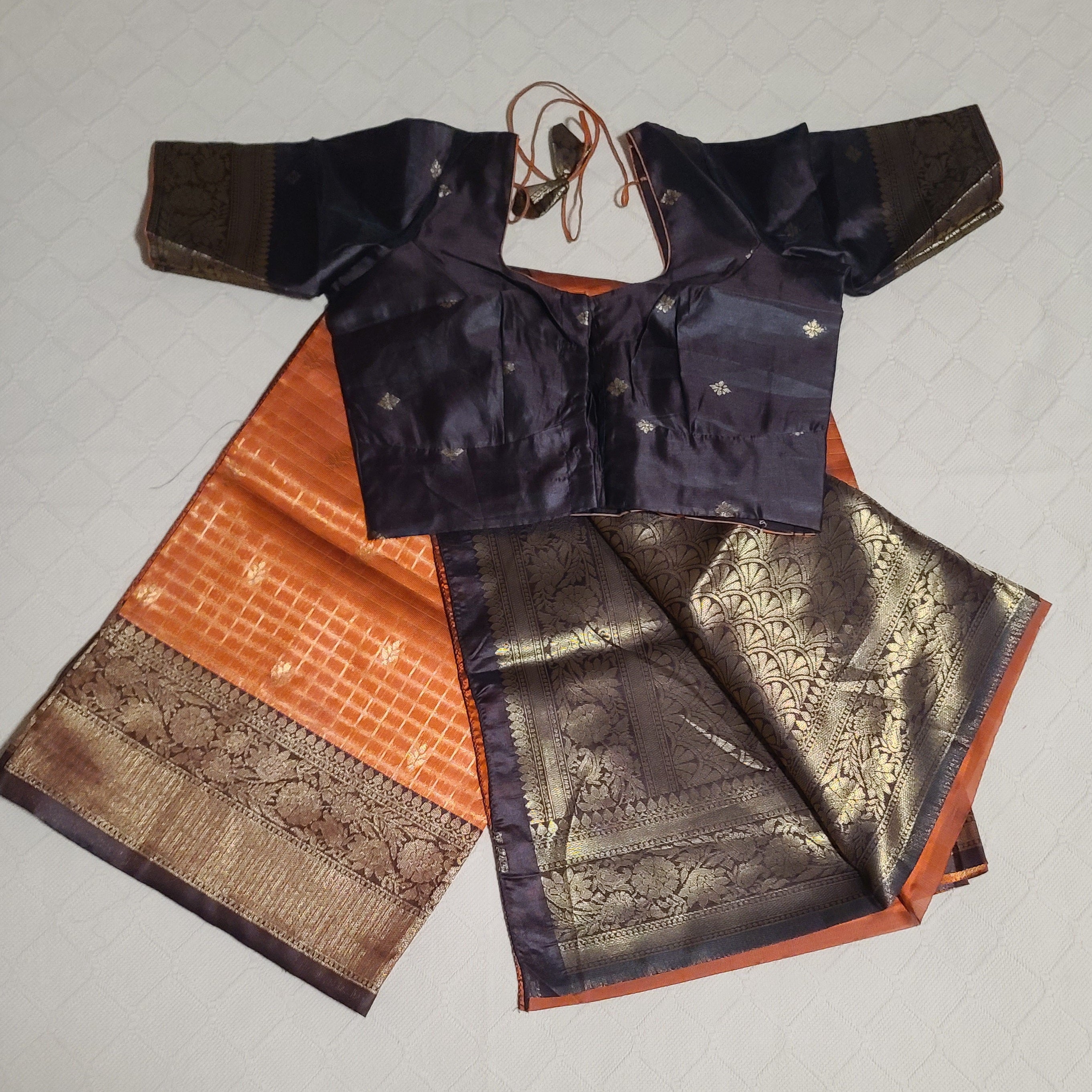 Rust orange and brown traditional semi silk saree