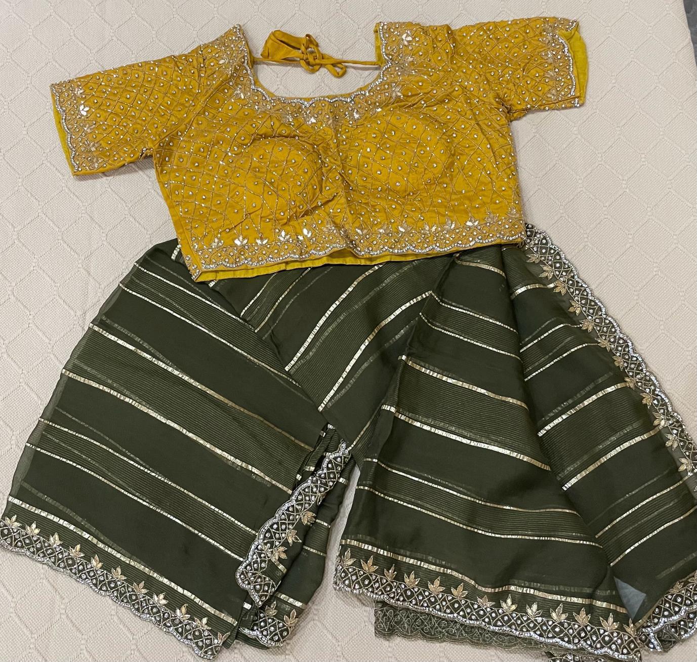 Premium Fancy Saree in green with yellow blouse and swarovski stone studded work in both saree and blouse