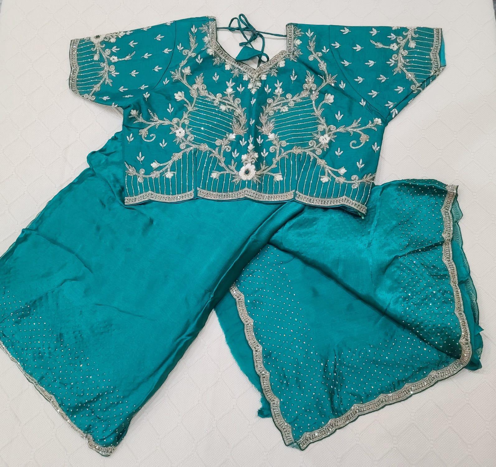 Premium Fancy Saree in dark teal blue color with swarovski stones in the saree border and blouse