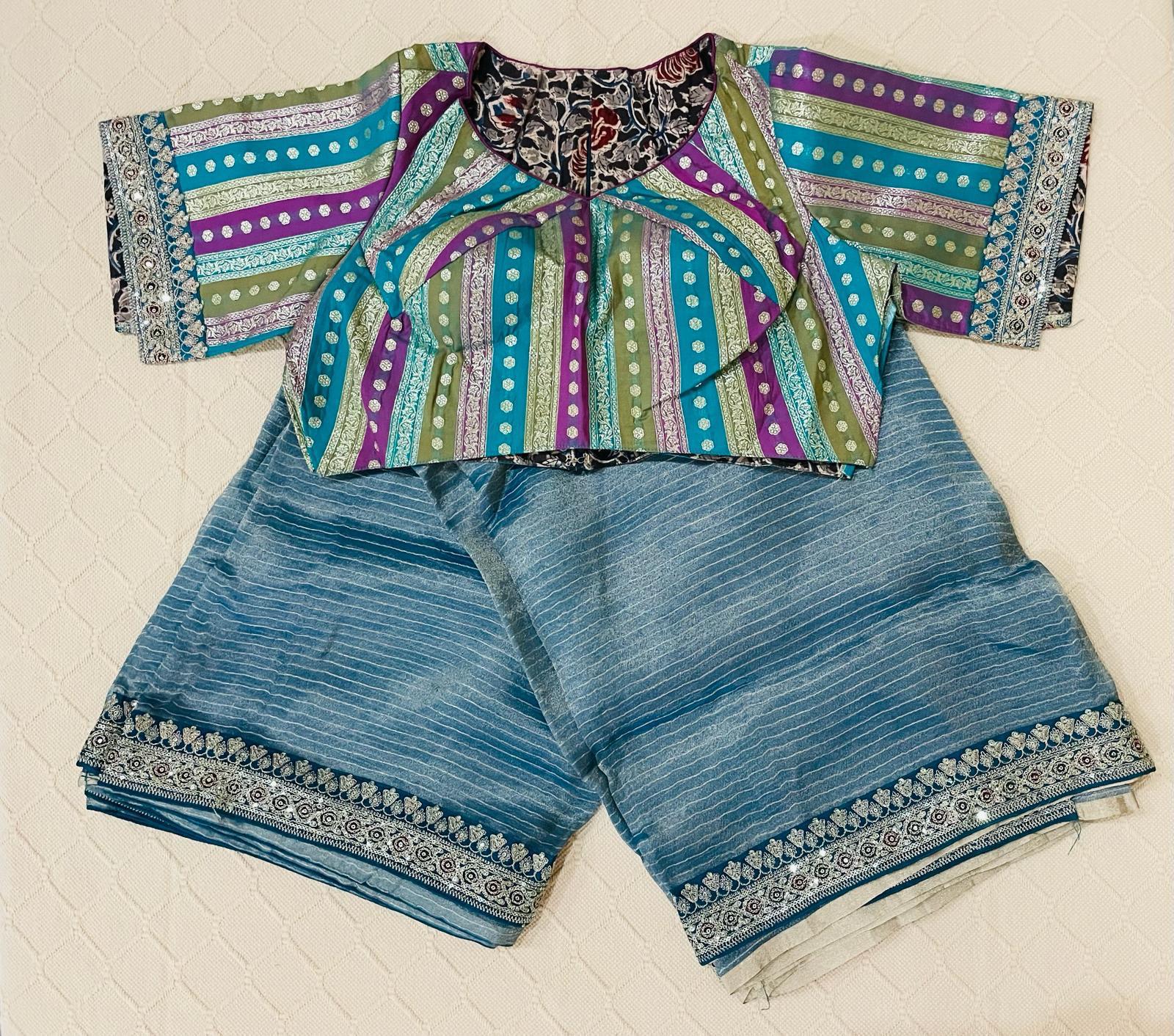 Premium Fancy Saree - Banarasi tissue in powder blue color with an elegant rich blouse